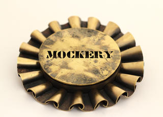 MOCKERY brooch