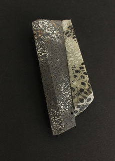 Shifting planes brooch